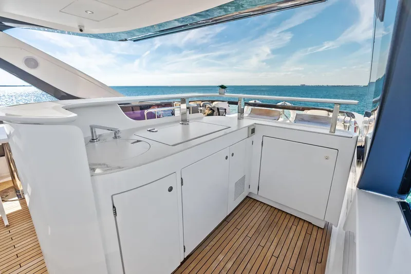  Yacht Photos Pics Luxurious 2021 Azimut Fly 78 yacht deck with sleek outdoor kitchen and ocean view.