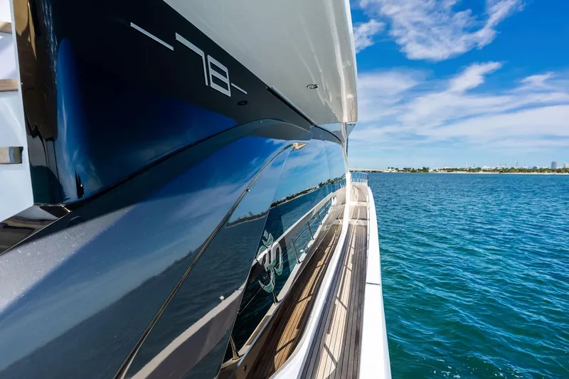  Yacht Photos Pics Azimut Fly 78 yacht, 2021 model, cruising on clear blue waters under a sunny sky.