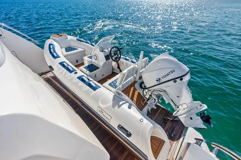  Yacht Photos Pics 2021 Azimut Fly 78 yacht with Tohatsu motor, docked on clear blue water.