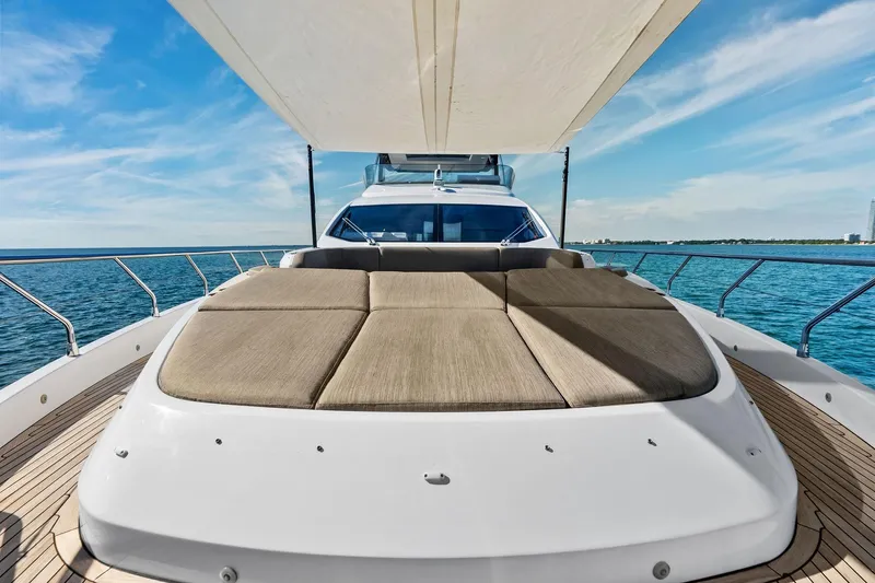  Yacht Photos Pics Luxurious 2021 Azimut Fly 78 yacht with spacious sun deck, cruising on open water.