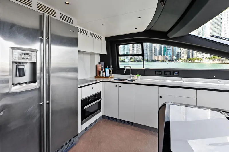  Yacht Photos Pics Modern kitchen interior on 2021 Azimut Fly 78 yacht with cityscape view.