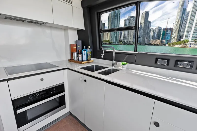  Yacht Photos Pics Modern kitchen interior on 2021 Azimut Fly 78 yacht with cityscape view.