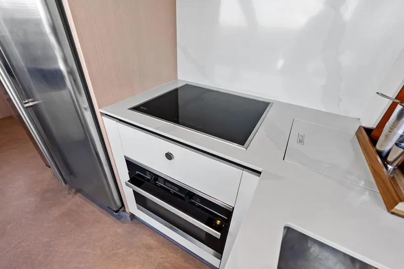  Yacht Photos Pics Modern kitchen in 2021 Azimut Fly 78 yacht with sleek appliances and minimalist design.