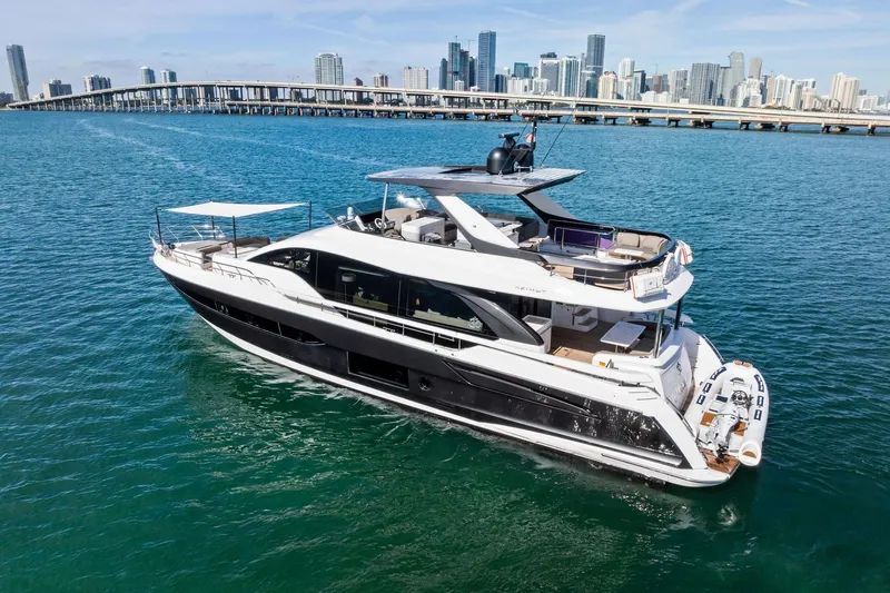  Yacht Photos Pics Azimut Fly 78 yacht cruising near city skyline, 2021 model.