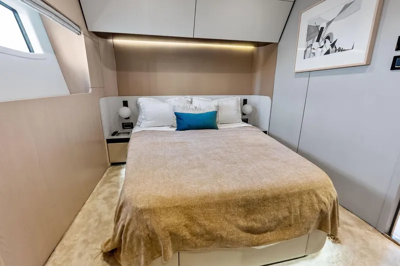  Yacht Photos Pics Luxurious bedroom interior of 2021 Azimut Fly 78 yacht with modern decor and cozy bedding.