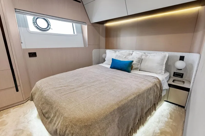  Yacht Photos Pics Luxurious bedroom interior of 2021 Azimut Fly 78 yacht with modern design and cozy bedding.