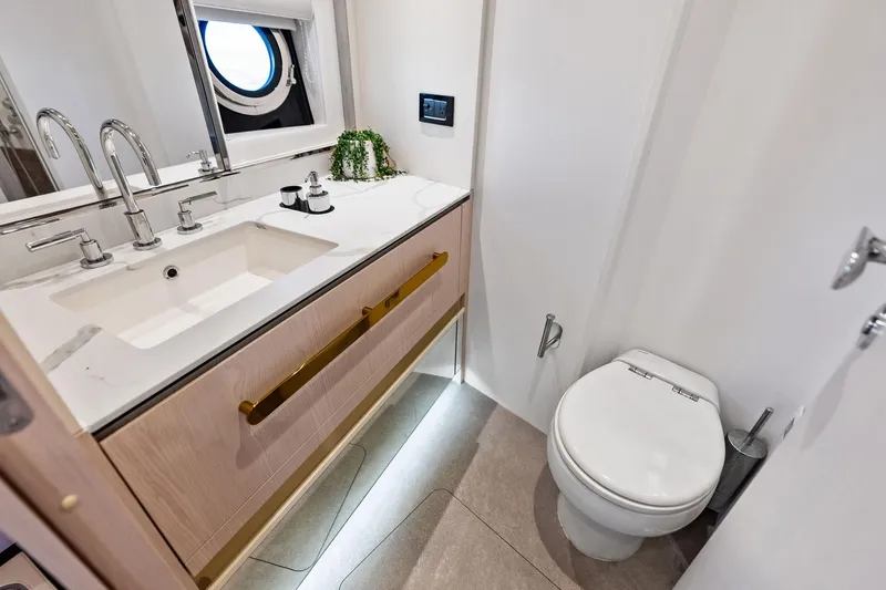  Yacht Photos Pics Luxurious bathroom in 2021 Azimut Fly 78 yacht with modern fixtures and elegant design.