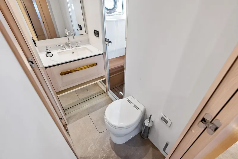  Yacht Photos Pics Luxurious bathroom in 2021 Azimut Fly 78 yacht, featuring modern fixtures and elegant design.