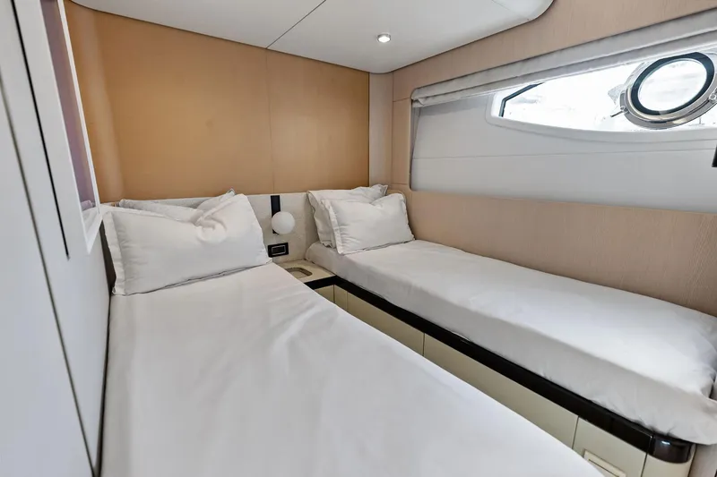  Yacht Photos Pics Interior of 2021 Azimut Fly 78 yacht cabin with twin beds and modern decor.
