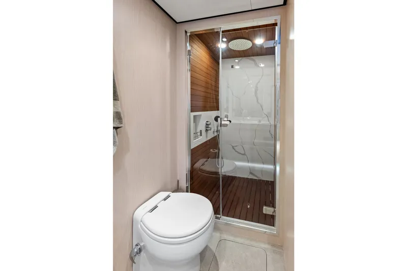  Yacht Photos Pics Luxurious bathroom in 2021 Azimut Fly 78 yacht with modern shower and toilet.