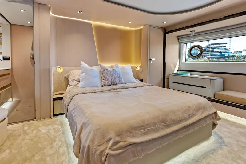  Yacht Photos Pics Luxurious bedroom interior of 2021 Azimut Fly 78 yacht with modern design and elegant furnishings.