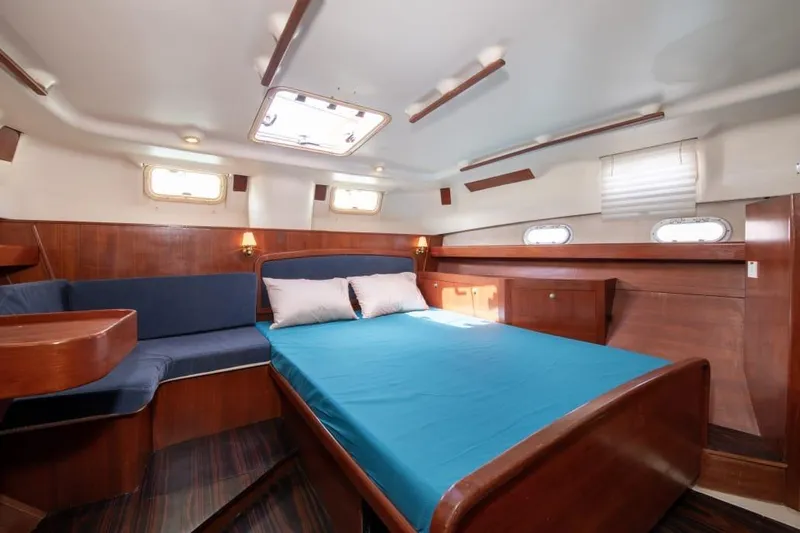  Yacht Photos Pics Luxurious cabin interior of 2000 Hunter 45 Center Cockpit yacht with wood finish.