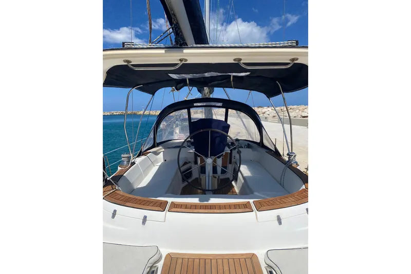  Yacht Photos Pics Hunter 45 Center Cockpit sailboat, 2000 model, featuring spacious deck and steering wheel.