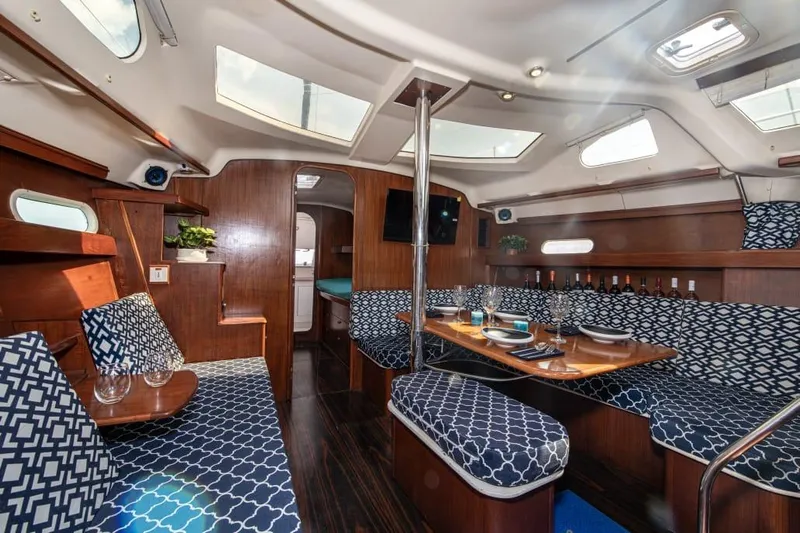  Yacht Photos Pics Luxurious interior of 2000 Hunter 45 Center Cockpit sailboat with elegant seating and dining area.