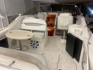 Interior of 2003 Regal 2765 boat with seating and table.