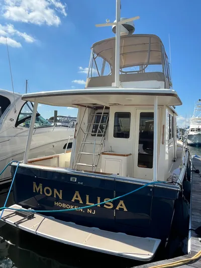 Mon Alisa Yacht Photos Pics 2004 Sabre 36 Sedan boat docked in Hoboken, NJ under clear blue sky.