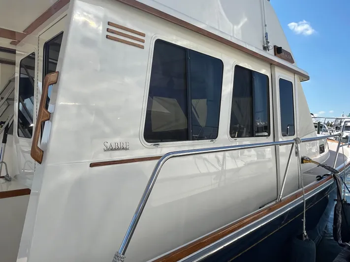 Mon Alisa Yacht Photos Pics 2004 Sabre 36 Sedan yacht with sleek white exterior and tinted windows.