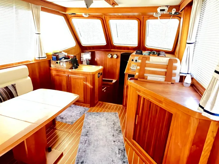 Mon Alisa Yacht Photos Pics Interior of 2004 Sabre 36 Sedan yacht with wood finish and seating area.