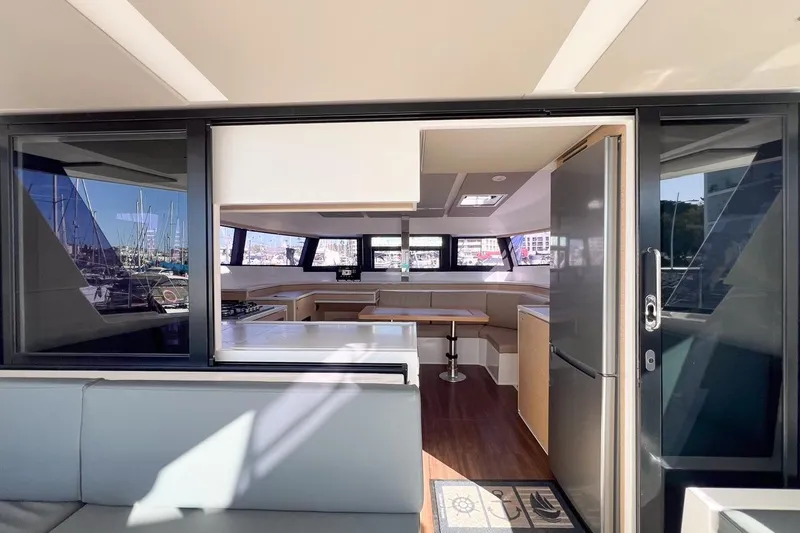 Just Wonder Yacht Photos Pics Modern interior of 2024 Cervetti 44 yacht with spacious kitchen and seating area.