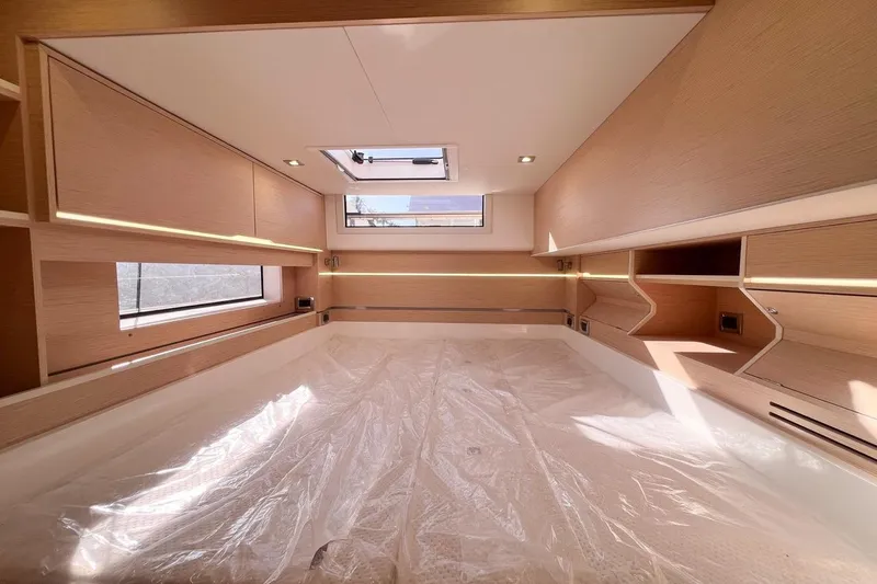 Just Wonder Yacht Photos Pics Modern interior of 2024 Cervetti 44 yacht with sleek wood finishes and ample natural light.