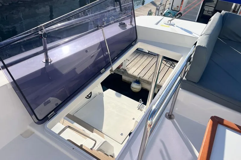 Just Wonder Yacht Photos Pics 2024 Cervetti 44 yacht deck with open hatch and seating area.