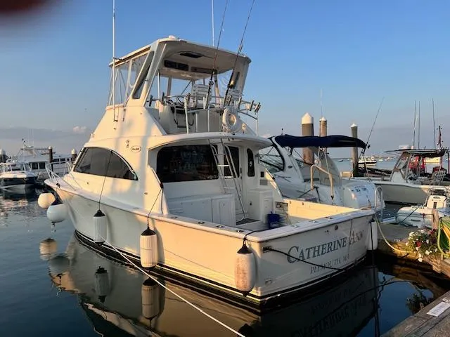 Catherine Ann Yacht Photos Pics 1998 Ocean Yachts 40 Super Sport docked at marina, rear view.