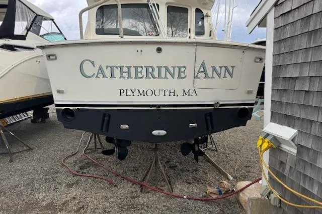 Catherine Ann Yacht Photos Pics 1998 Ocean Yachts 40 Super Sport boat named "Catherine Ann" in Plymouth, MA, docked on land.