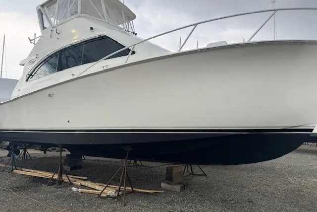 Catherine Ann Yacht Photos Pics 1998 Ocean Yachts 40 Super Sport boat on stands, side view.