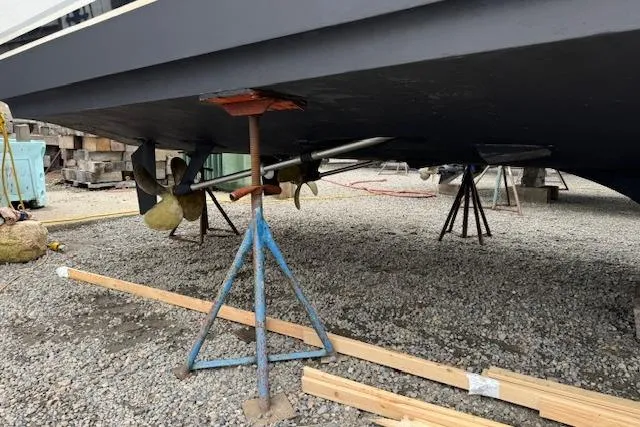 Catherine Ann Yacht Photos Pics 1998 Ocean Yachts 40 Super Sport on stands, showing propellers and hull.