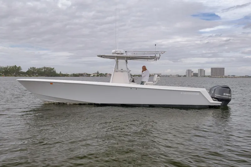  Yacht Photos Pics 2012 Contender 32 Tournament boat on calm water, overcast sky.