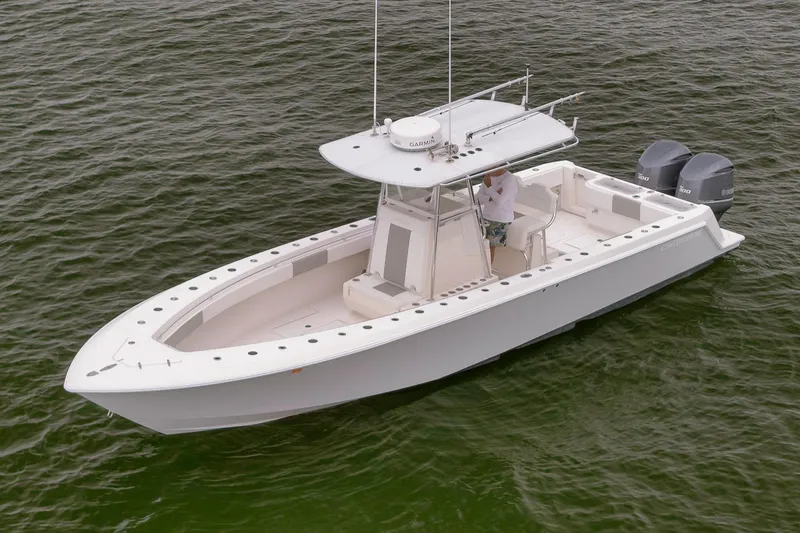  Yacht Photos Pics 2012 Contender 32 Tournament boat on water, featuring dual outboard engines.