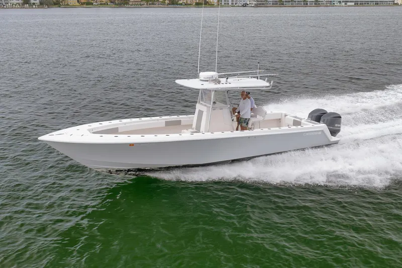  Yacht Photos Pics 2012 Contender 32 Tournament boat cruising on open water.