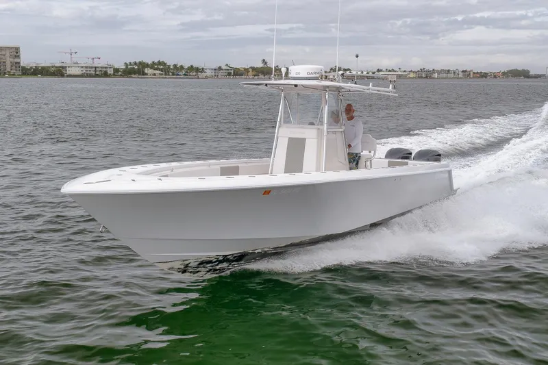  Yacht Photos Pics 2012 Contender 32 Tournament boat cruising on open water.