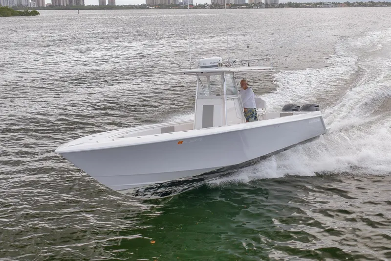  Yacht Photos Pics 2012 Contender 32 Tournament boat cruising on open water.