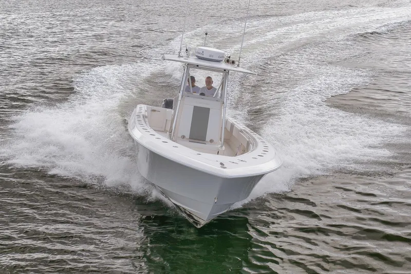  Yacht Photos Pics 2012 Contender 32 Tournament boat cruising on open water.