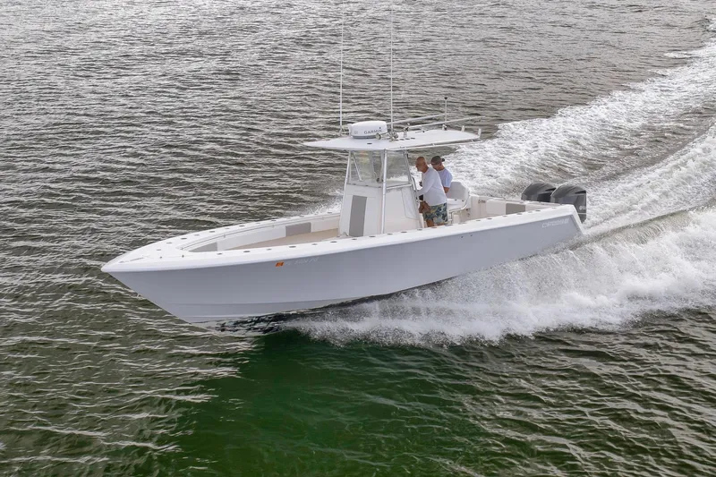  Yacht Photos Pics 2012 Contender 32 Tournament boat cruising on open water.