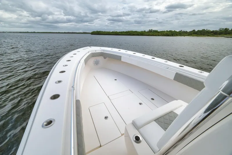  Yacht Photos Pics 2012 Contender 32 Tournament boat on calm waters under cloudy skies.