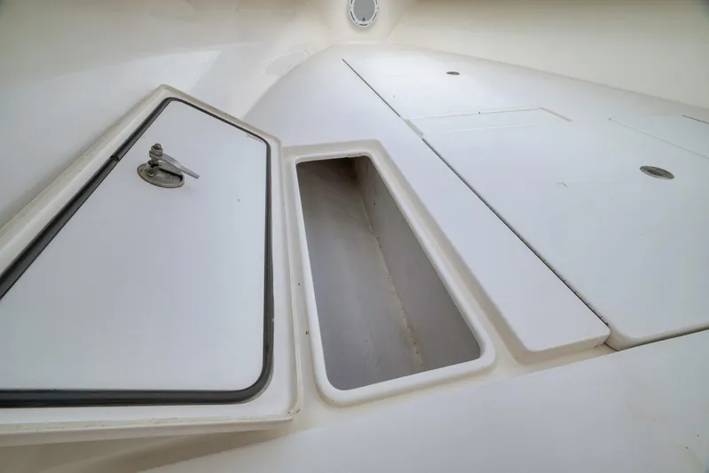  Yacht Photos Pics 2012 Contender 32 Tournament boat storage compartment with open hatch.