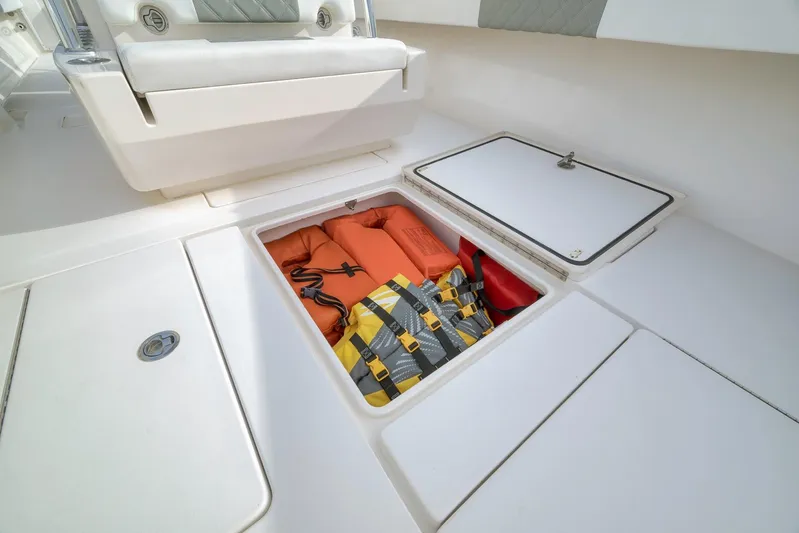  Yacht Photos Pics 2012 Contender 32 Tournament boat storage with life jackets and safety gear.