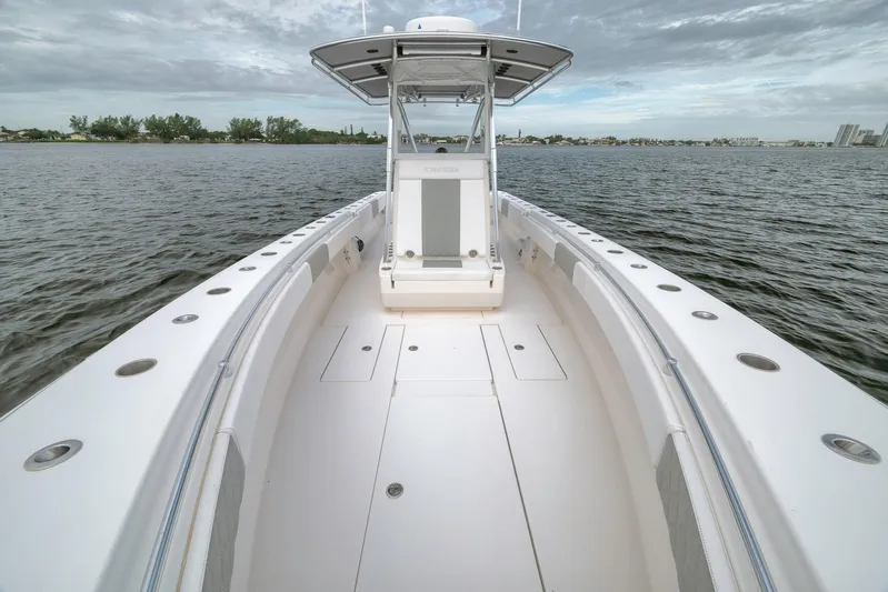  Yacht Photos Pics 2012 Contender 32 Tournament boat on calm water under cloudy sky.