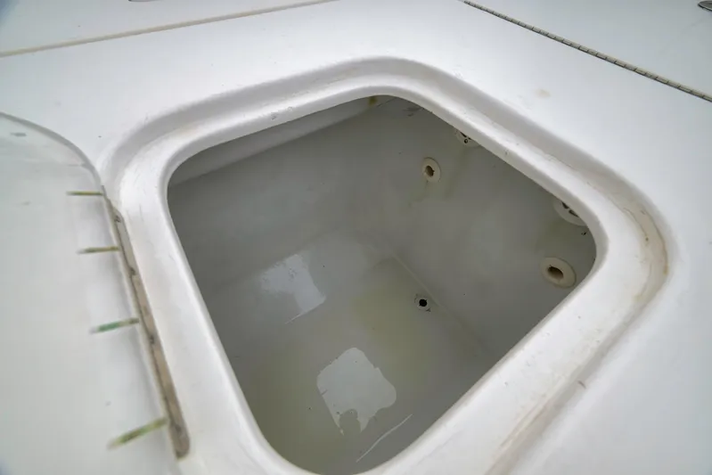  Yacht Photos Pics Livewell compartment on a 2012 Contender 32 Tournament boat, showcasing interior details.