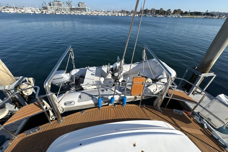 Ganymede Yacht Photos Pics Deck view of 2001 North Wind 56 yacht with inflatable boat and Honda motor.
