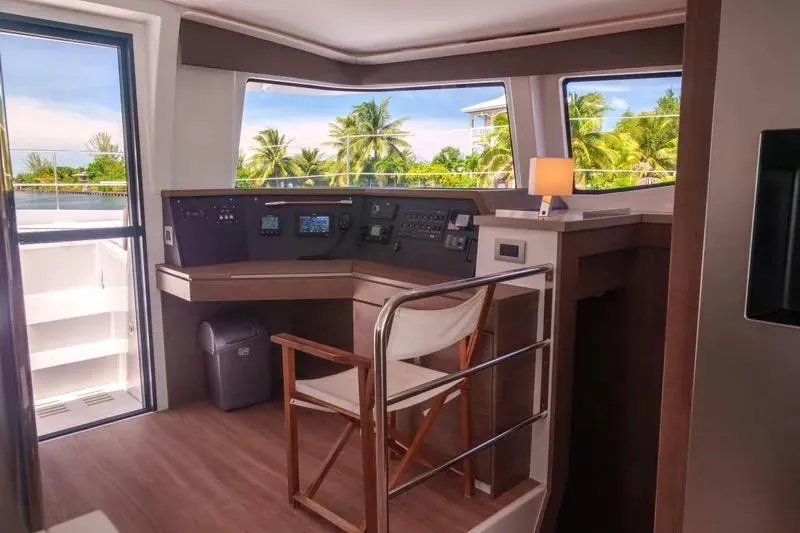  Yacht Photos Pics Interior of 2023 Bali 4.4 yacht helm with tropical view and modern controls.