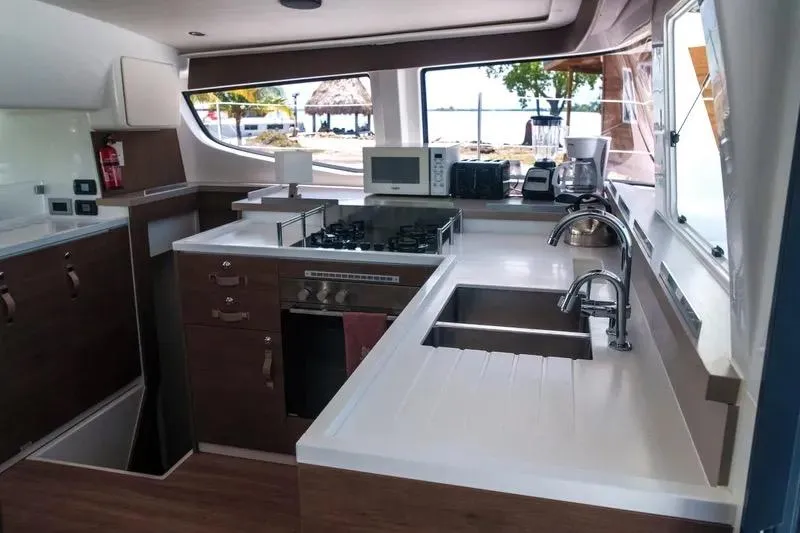  Yacht Photos Pics Modern kitchen interior on a 2023 Bali 4.4 yacht, featuring appliances and ocean view.
