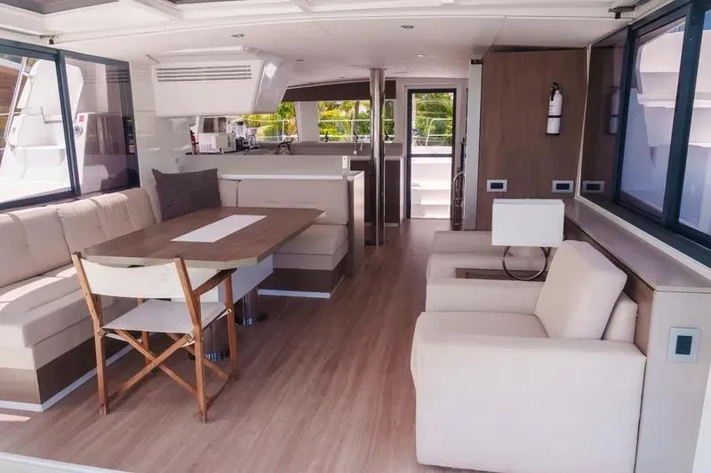 Yacht Photos Pics Luxurious interior of 2023 Bali 4.4 yacht with modern seating and dining area.