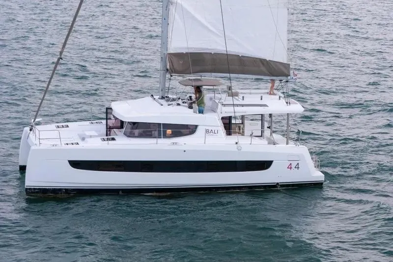  Yacht Photos Pics 2023 Bali 4.4 catamaran sailing on open water, showcasing sleek design and modern features.