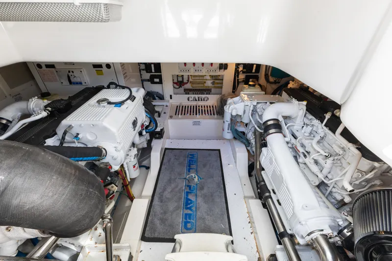 Well Played Yacht Photos Pics Engine room of 2011 Cabo 40 Flybridge yacht, showcasing dual engines and equipment.