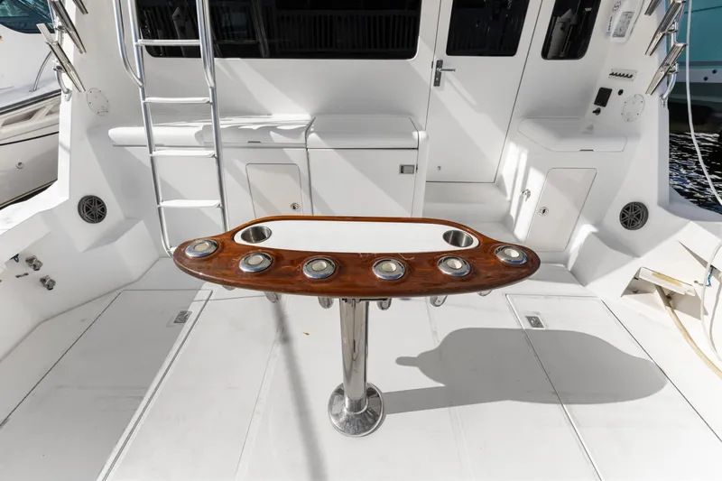 Well Played Yacht Photos Pics 2011 Cabo 40 Flybridge yacht cockpit with rod holders and ladder.