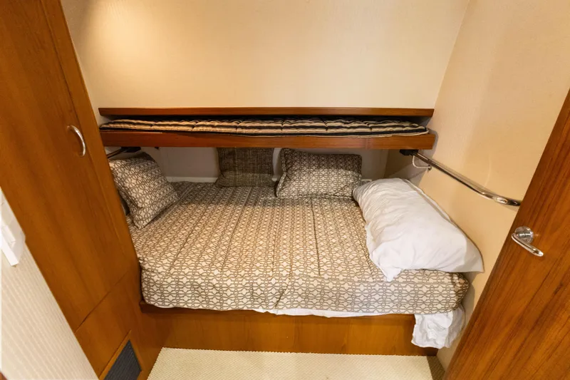 Well Played Yacht Photos Pics Cozy cabin bedroom in 2011 Cabo 40 Flybridge yacht with patterned bedding.