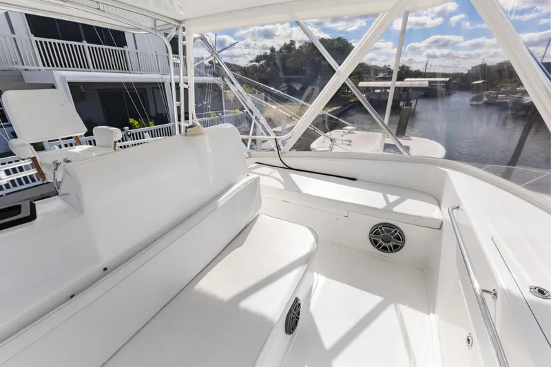 Well Played Yacht Photos Pics 2011 Cabo 40 Flybridge interior with white seating and marina view.